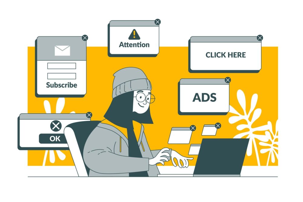 Osoba przy komputerze otoczona elementami reklamy internetowej